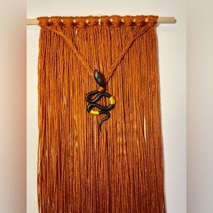 Macrame wall hanging with snake